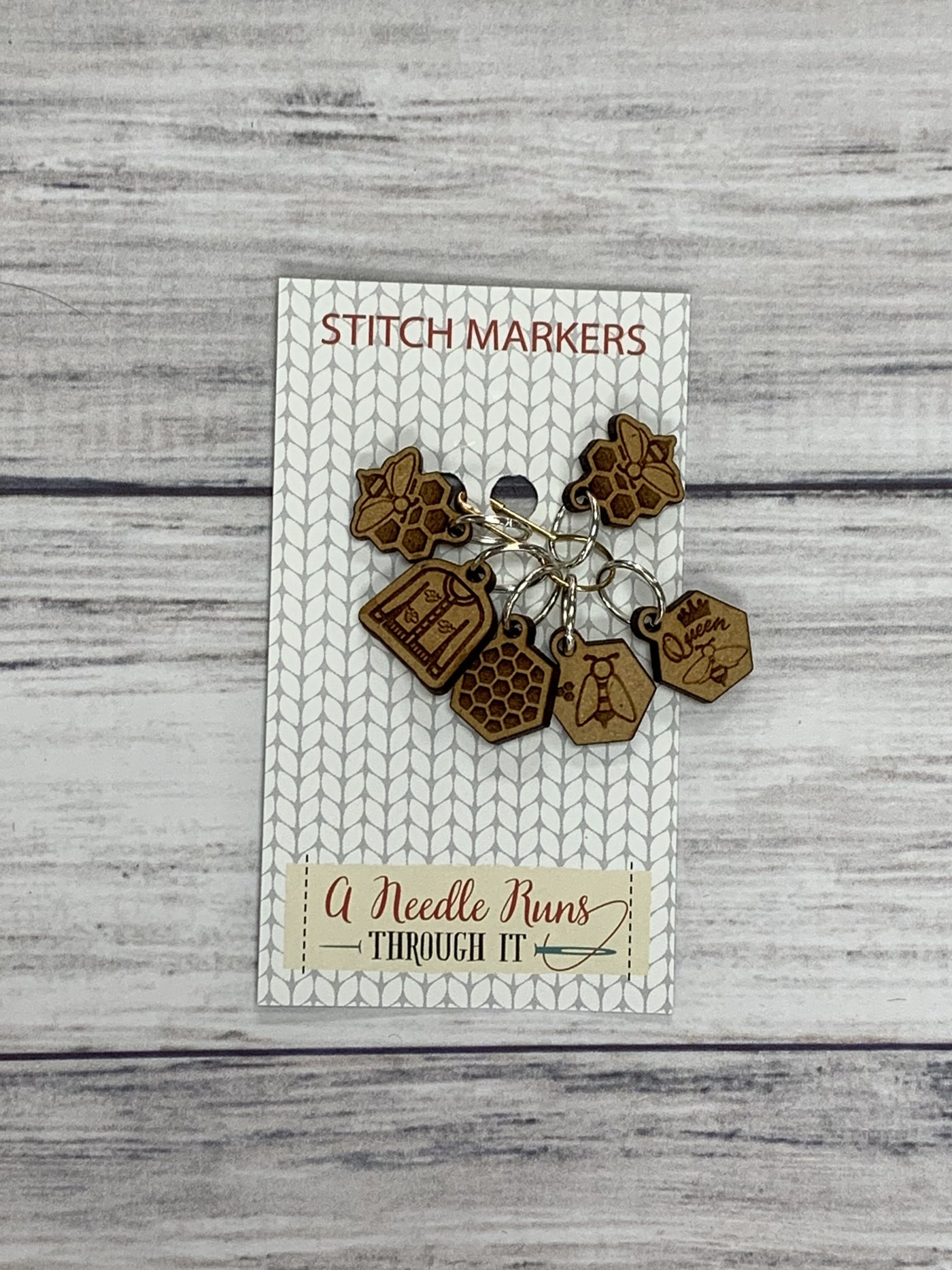 Wooden Ring Stitch Markers by A Needle Runs Though It